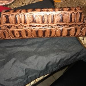 Ladies brown crocodile effect clutch.
